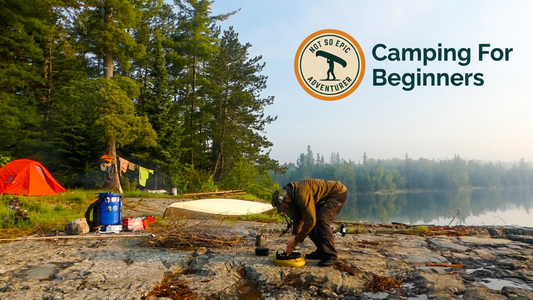 Camping scene with a person by a lake, trees, and 'Camping For Beginners' logo.