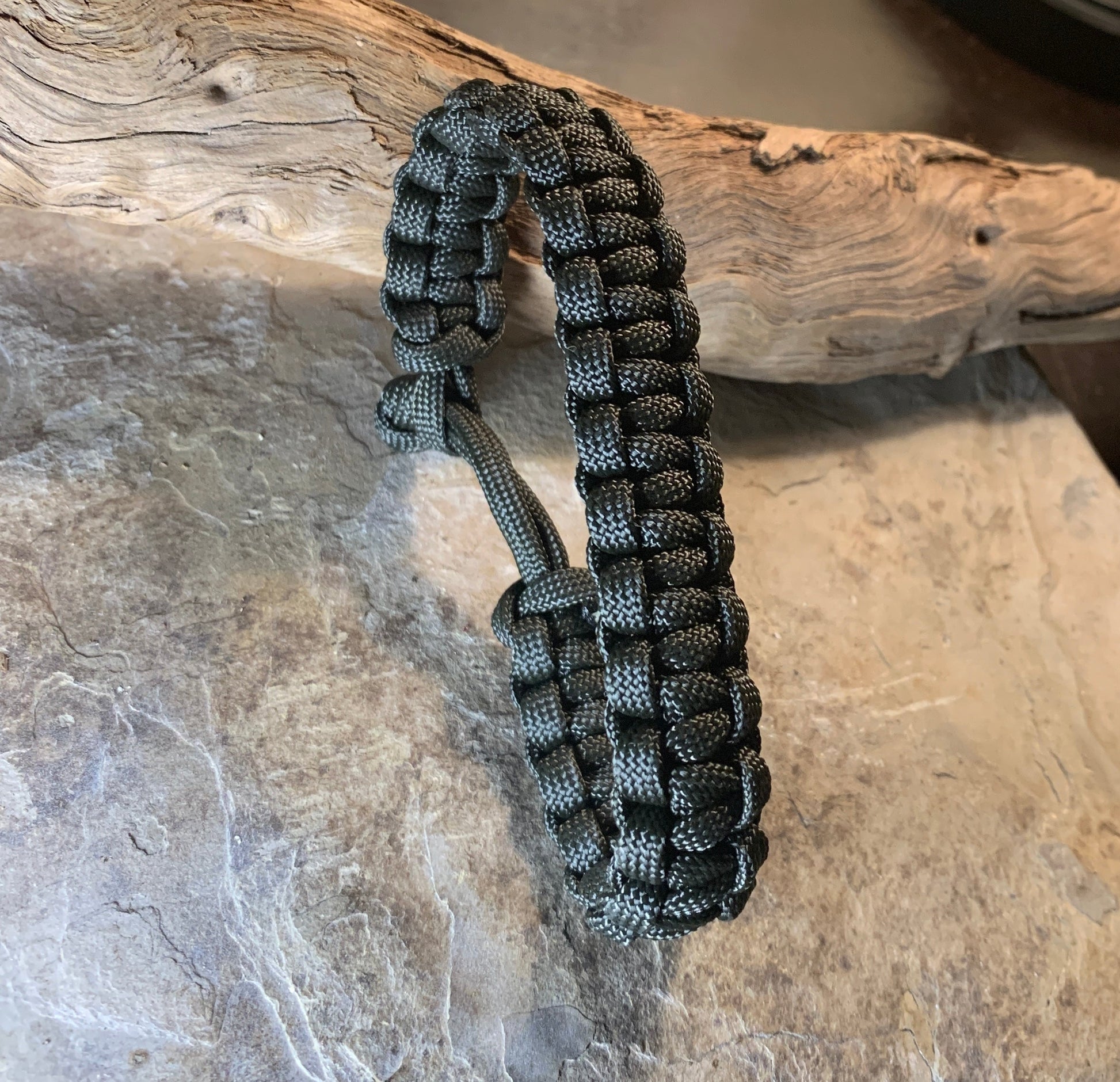 4 in 1 bushcraft paracord survival bracelet includes 15 meters of paracord, firestarter cord, and fishing line for all your survival needs on your wrist, notsoepicadventurer